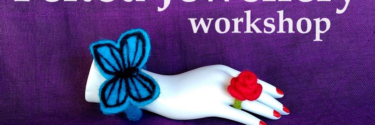 A white mannequin hand on a purple background, wearing a blue felted butterfly bracelet and red felted rose ring. The words Kawaii Felted Jewellery workshop NAMI OSAKI in text.