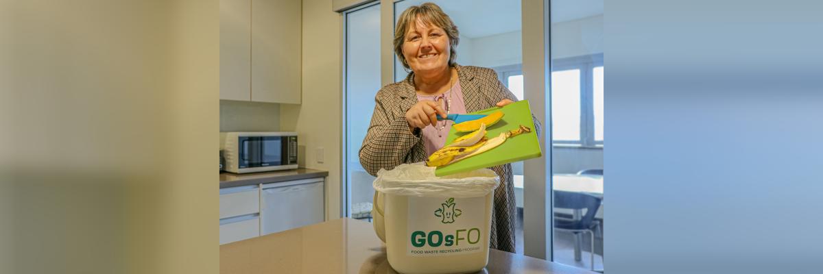 City of Gosnells Mayor Terresa Lynes adds food scraps to a new GOsFO bin, ready to take part in a pilot program to convert waste into high quality fertiliser and protein  for animal feed, the first of its kind in Western Australia. 