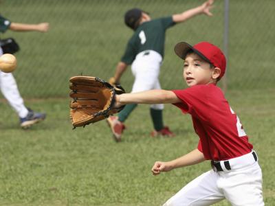 Image of boy catching baseball with glove