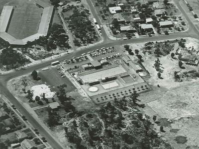 Aerial image of Thornlie showing the 50m Olympic swimming pool at the centre and Thornlie Primary School in the top right.  The Thornlie Library is under construction in the bottom left corner.