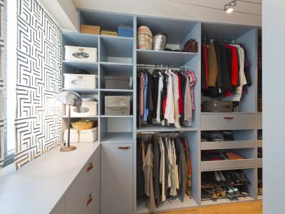 A neatly organised and compartmentalised wardrobe full of clothes