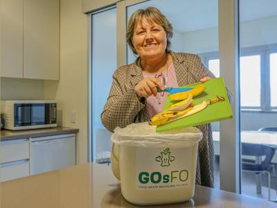 City of Gosnells Mayor Terresa Lynes adds food scraps to a new GOsFO bin, ready to take part in a pilot program to convert waste into high quality fertiliser and protein  for animal feed, the first of its kind in Western Australia. 