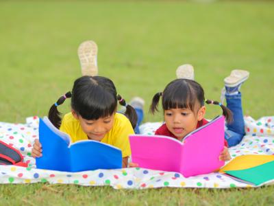 children reading outside